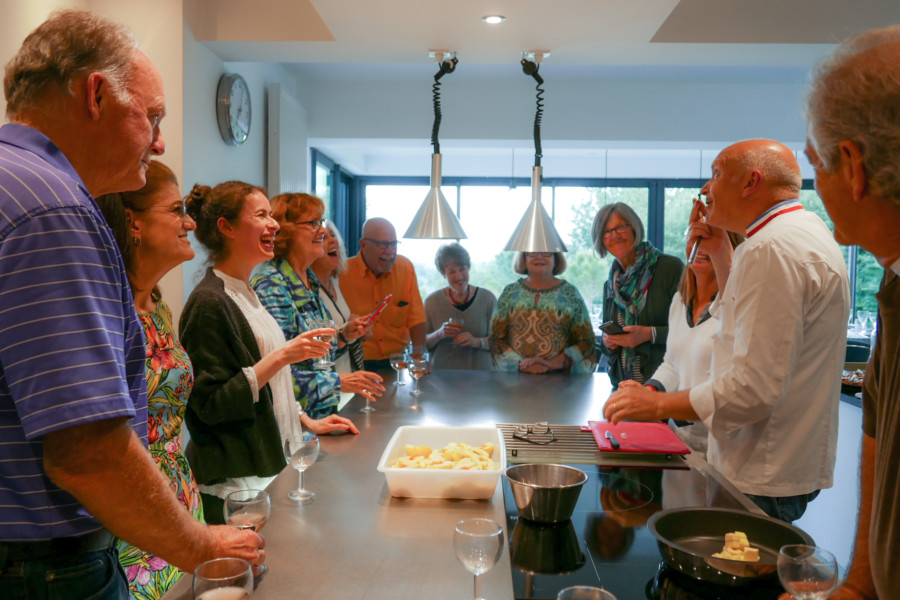 People enjoying culinary class Loire Valley France Castles Tour