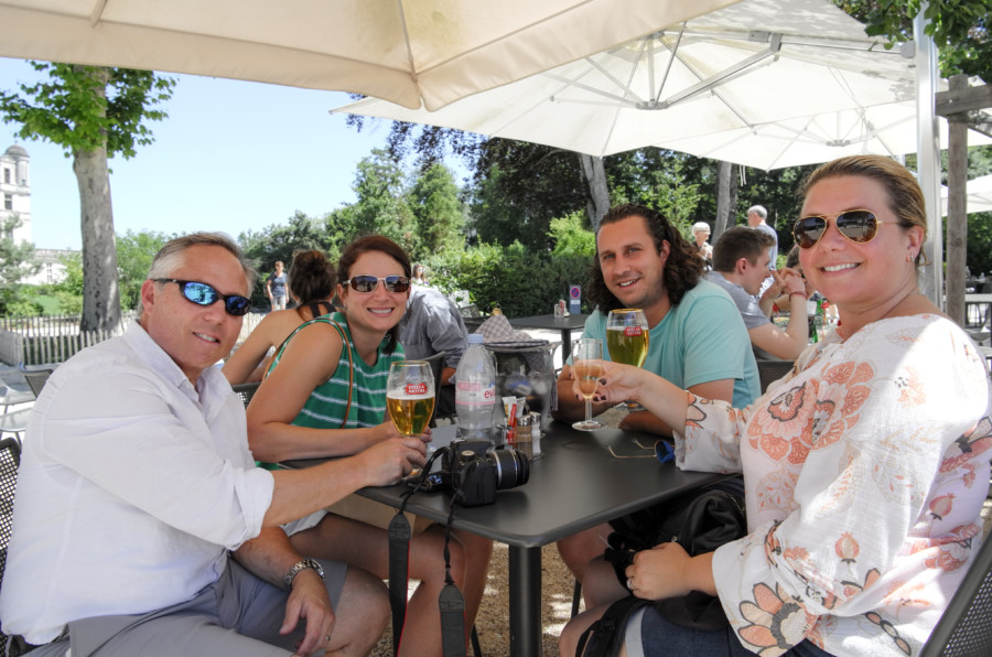 Four people drinking, a nd enjoying the sun in one restaurant in Loire valley. Loire valley tour prices & inclusions page 