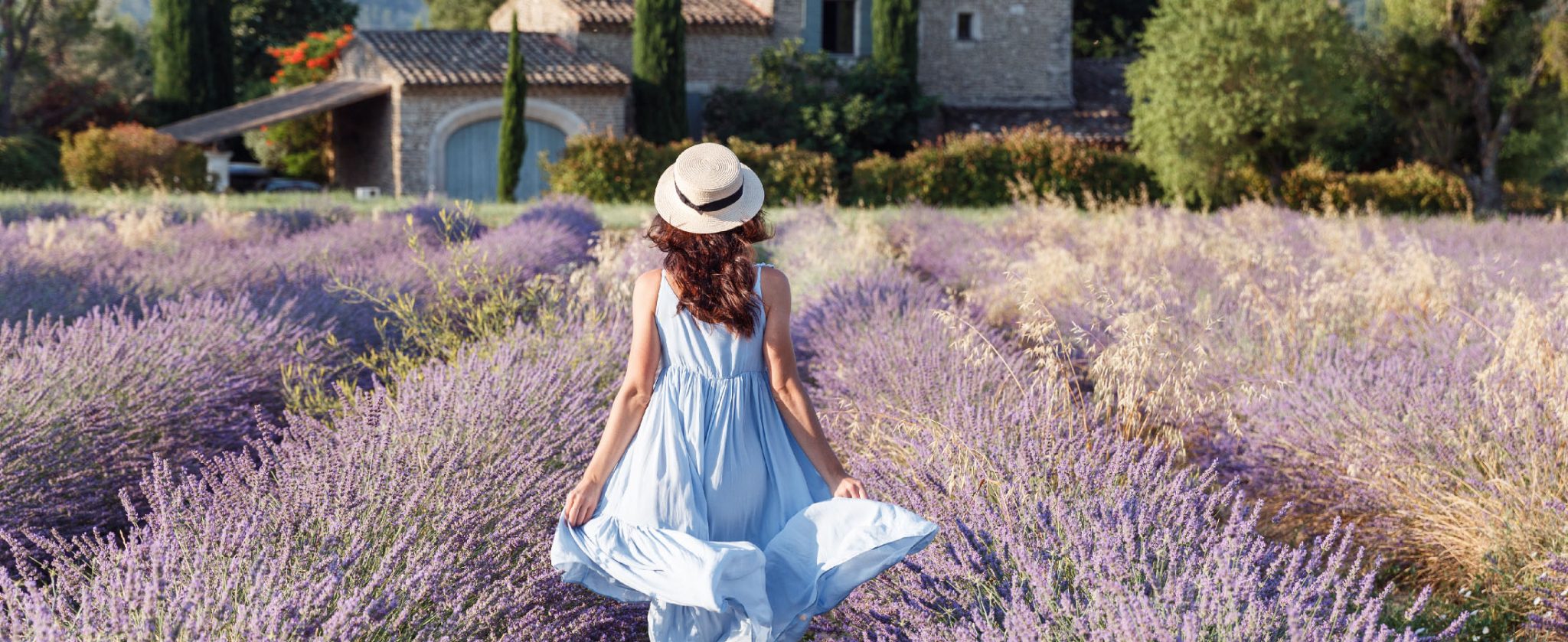Girl running through lavander fields, enjoying her Provence walking tour