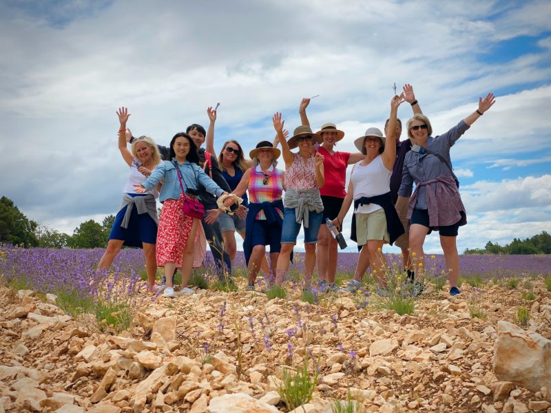 Happy people posing in the lavender field, 2023 Provence tour dates