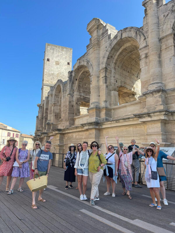 Provence tour guests enjoying our guided cultural walk of the Roman ruins of Arles.