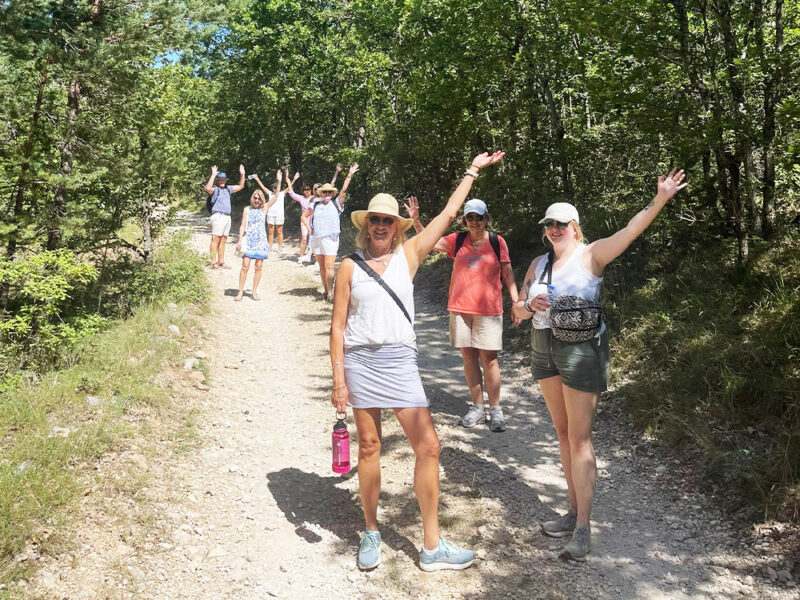 Provence tour guests walking through countryside to see lavender