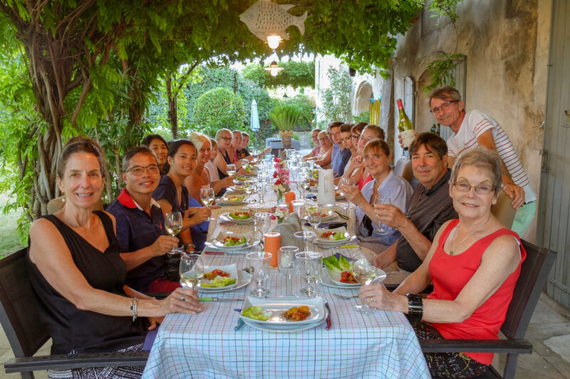 tour guests enjoying dinner at home in Provence
