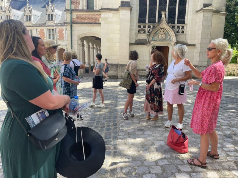 Guiding at chateau of Blois in Loire Valley with tour guests