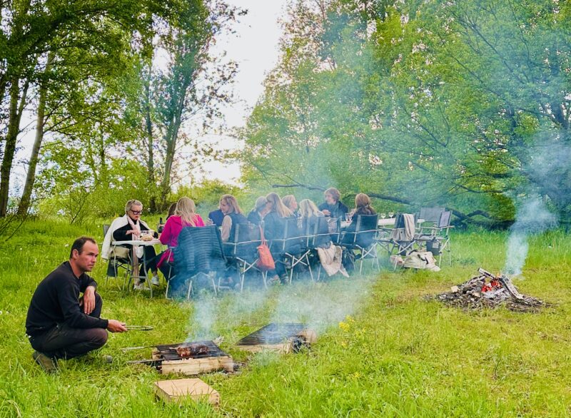 Guests at welcome dinner on our private island during France Off the Beaten Path Loire Valley Tour.