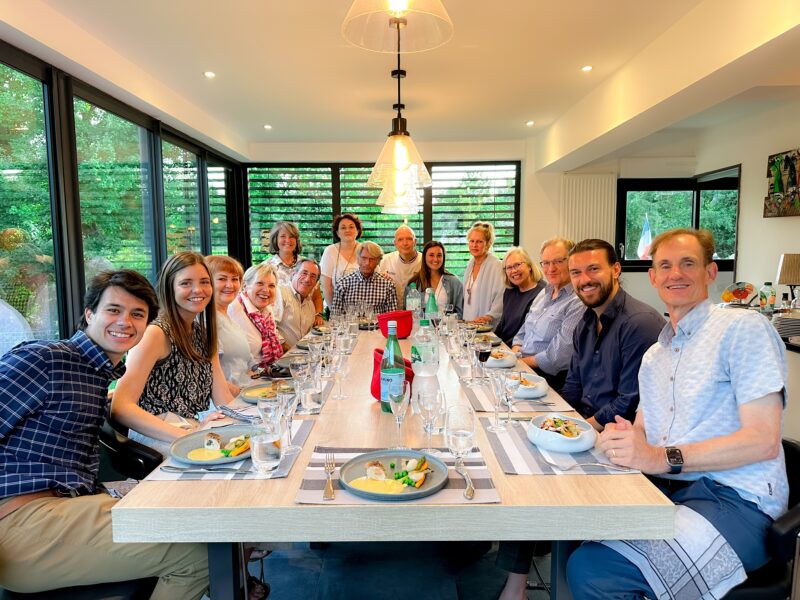 Guests enjoying dinner at home with our local French friends Christophe and Angelique during France Off the Beaten Path Loire Valley tour.