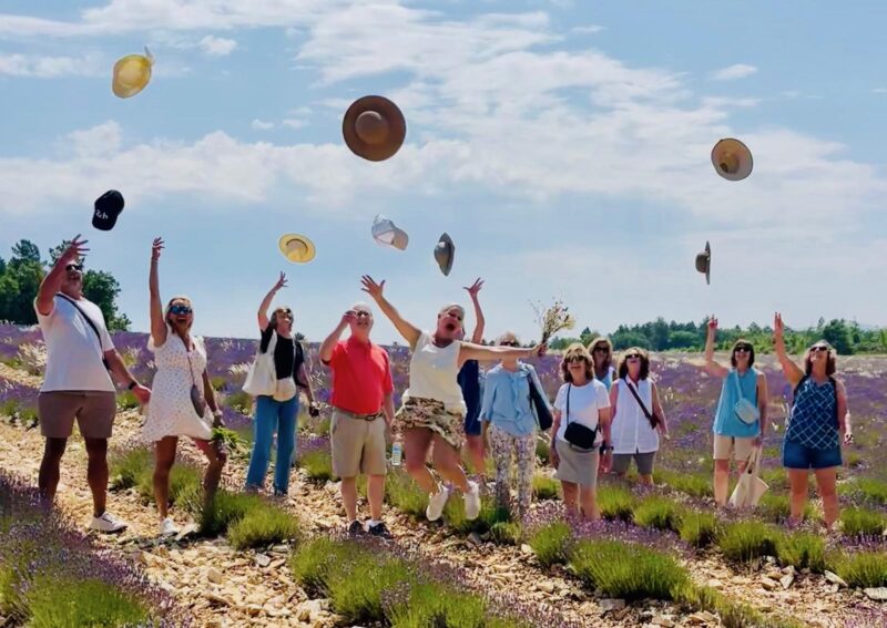June 2025 tour guests strolling through lavender fields during France Off the Beaten Path Provence tour.