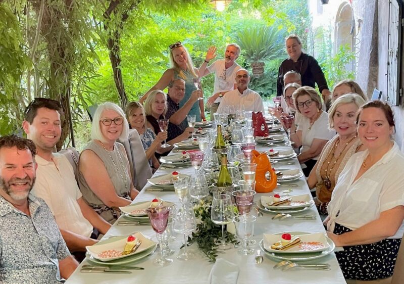 June 2025 tour guests at welcome dinner at our friend, Master Chef Catherine's home during France Off the Beaten Path Provence tour.