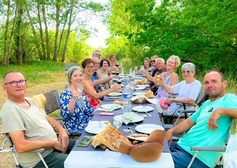 Loire Valley tour guests enjoying dinner on a private island during our float down the Loire River