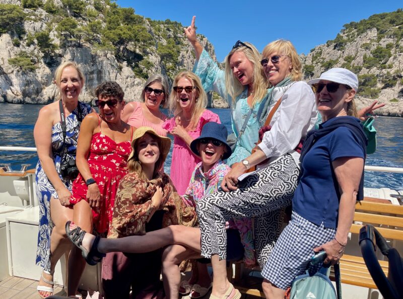 July lavender season Provence tour guests having fun during our calanques cruise in Cassis, France.