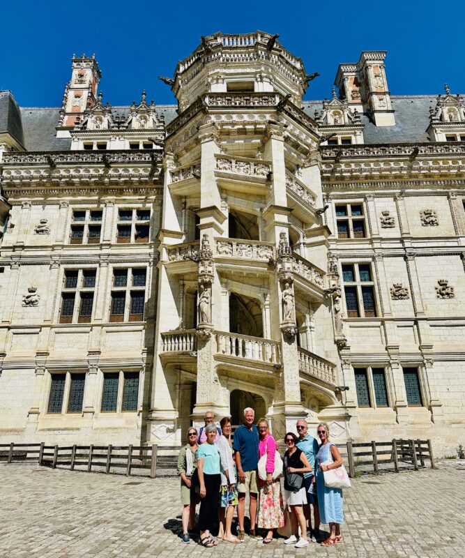 Loire Valley tour guests inside the courtyard at Blois castle during France Off the Beaten Path Loire Valley tour itinerary.
