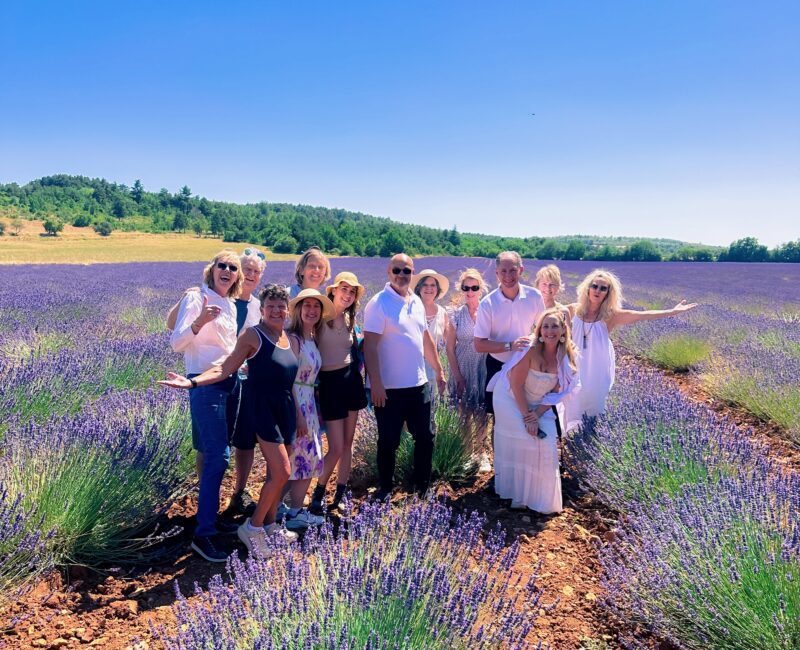 July 2025 tour guests in the lavender fields during France Off the Beaten Path Provence tour.