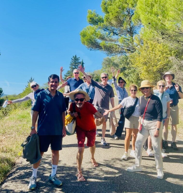 September tour guests walking in the Luberon Valley during France Off the Beaten Path Provence tour.