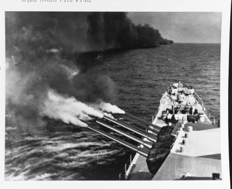 USS Quincy fires her guns onto the southern coast of France