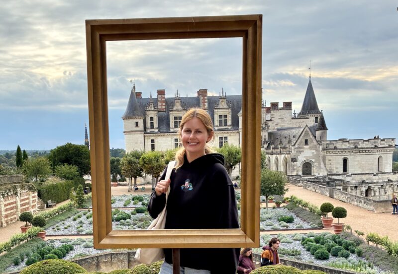 Freelance journalist, Chloé Destremau at the Royal Castle of Amboise in the autumn during Loire Valley Tour.