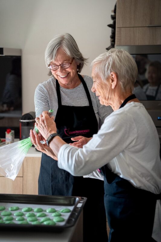 April Provence tour guests making macarons during pastry class at home with our pastry chef.