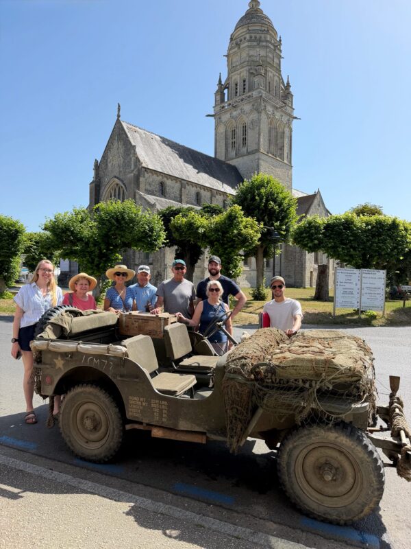 June 2026 Normandy Tour guests with historian guide Dylan learning about WWII